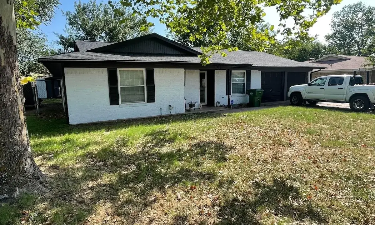 Professional roofing crew working on a residential roof in Corpus Christi